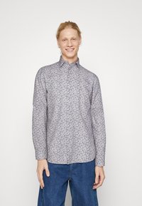 Langärmelig shirt van lichte stof, met een blauw bloemmotief op een witte achtergrond. Met een button-down kraag en een regular fit ontwerp.