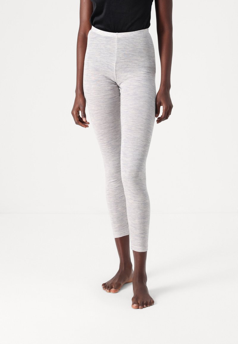 Light gray leggings with a subtle heathered texture, high waist design, and a fitted silhouette, styled with a black top, barefoot.