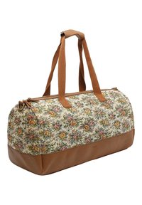 Sac de voyage en tissu floral avec une base en cuir marron, doté de deux poignées en tissu marron et d'une forme arrondie, idéal pour les voyages.