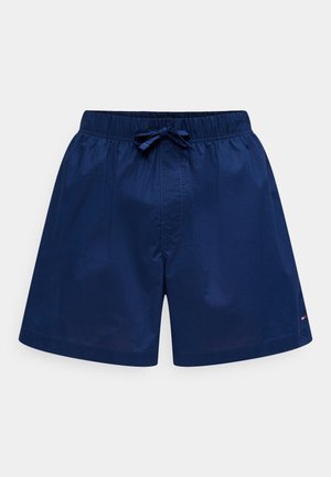 Navy blue men's swim shorts with elastic waistband and front drawstring, small logo on lower side, plain design.