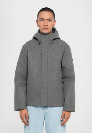 Gray, hooded jacket with a textured finish, featuring a front zip closure, side pockets, and a relaxed fit.