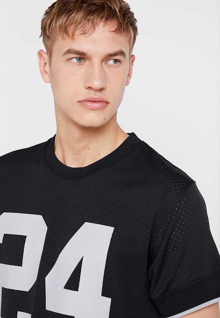 charles woodson mitchell and ness