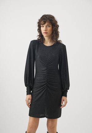 Black ruched dress made of textured fabric, featuring long puffed sleeves and a round neckline. Shimmering finish adds visual interest.