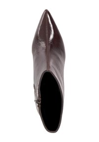 Burgundy leather ankle boot with a pointed toe, sleek finish, side zipper detail, and smooth texture, showcasing sophisticated design.