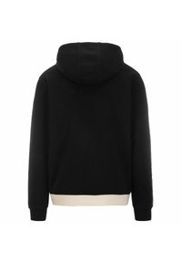 Sudadera negra con capucha y banda inferior color crema. Tiene mangas largas y una textura de tela suave. Vista trasera, diseño minimalista.