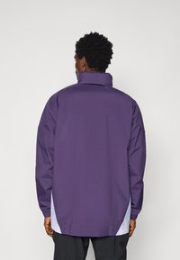 adidas Performance MANCHESTER UNITED ALL WEATHER JACKET - Vereinsmannschaften - aurora plum/white/black