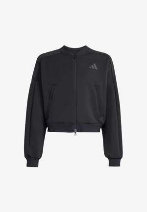 Crna kratka dukserica s visokim ovratnikom, zatvaračem, dva prednja džepa i suptilnim logom na prsima. Mekana tekstura, opušteni kroj.