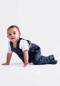 Navy waterproof overalls with adjustable straps, featuring a soft texture and practical closures, suitable for crawling infants.