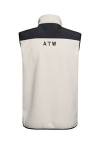 Fleeceväst i krämfärg med en svart övre del. Har en hög krage och "ATW" broderat på baksidan. Mjuk textur, utan ärmar.