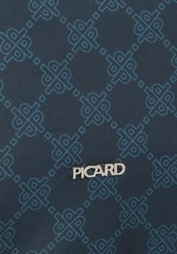 Navy bag with a textured surface featuring a geometric blue pattern. Silver "PICARD" logo is prominently displayed.