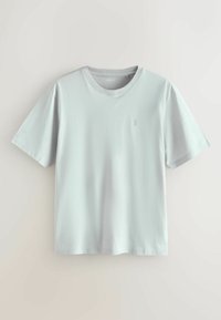 Svetlosivý krátky rukáv tričko vyrobené z jemnej bavlny. Klasický dizajn s okrúhlym výstrihom a jemným logom na ľavej hrudi. Hladká štruktúra.