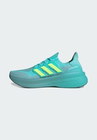 Teal athletic shoe featuring a mesh upper, three reflective yellow stripes, and a cushioned sole with a textured grip.