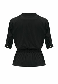 Blouse noire à manches trois-quarts, avec poignets boutonnés, col large et taille élastique, présentée de dos sur fond blanc.