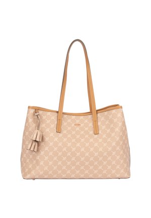 Beige shopper-taske med lysebrune læderhåndtag og kant, dekorative frynser på den ene side og et subtilt gentaget bladmotiv.