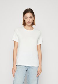 Weißes Baumwoll-T-Shirt mit kurzen Ärmeln, Rundhalsausschnitt und lässiger Passform. Verfügt über eine glatte Textur und ein minimalistisches Design.