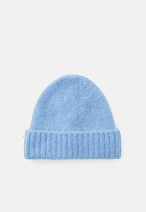 Light blue knit beanie made of soft material, featuring a ribbed folded brim and a rounded top, with a smooth texture throughout.