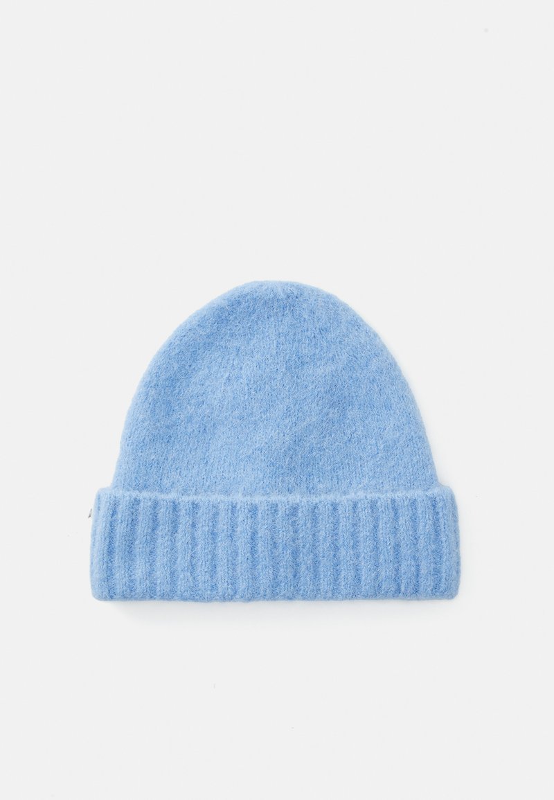 Light blue knit beanie made of soft material, featuring a ribbed folded brim and a rounded top, with a smooth texture throughout.