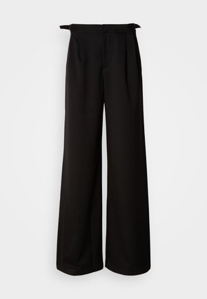 Pantaloni neri a gamba larga con vita alta, caratterizzati da pieghe e nastri decorativi sui lati, realizzati in un tessuto liscio e strutturato.