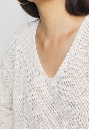 Stickad tröja - beige