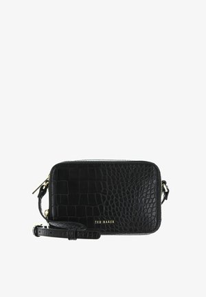 Sac bandoulière noir à texture crocodile, fermeture éclair dorée, sangle ajustable et logo "TED BAKER" sur le devant.