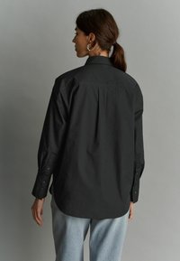 Next OVERSIZED  - Paitapusero - black