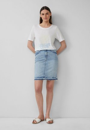 White cotton t-shirt with a pastel graphic, paired with a light denim pencil skirt featuring a frayed hem and light blue sandals.