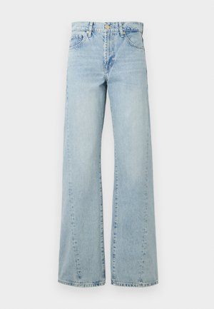 Světlé modré široké džínsy vyrobené z denimu, s knoflíkovým zapínáním, předními kapsami a zesvětlenými oblastmi pro texturu a detail.