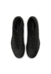 Black athletic shoes with a textured upper, featuring a herringbone pattern, rounded toe, and lace-up design. Nike logo on the side.