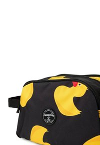Borsa da toeletta nera con un motivo di anatre di gomma gialle. Realizzata in tessuto resistente con una toppa rotonda e una chiusura a zip.