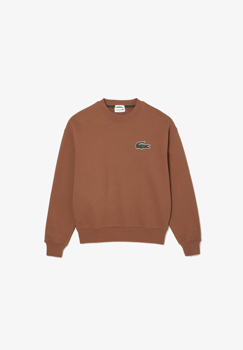 Sweat-shirt en coton marron avec poignets et ourlet côtelés. Présente un logo crocodile vert brodé sur la poitrine gauche. Design épuré.