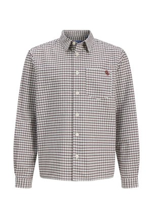 Chemise à manches longues boutonnée avec un motif à carreaux marron et blanc et une poche poitrine arborant un petit logo brodé sur le côté droit.
