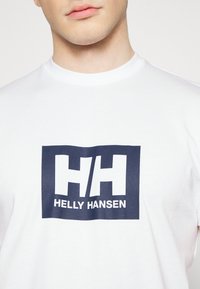 Helly Hansen HH BOX - Triko s potiskem - white