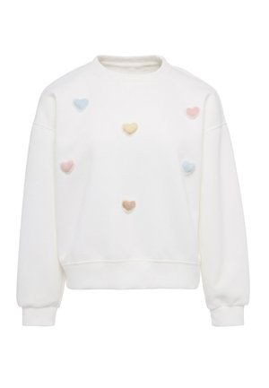 Hvid sweatshirt med lange ærmer, dekoreret med pastelfarvede blå, lyserøde, gule og brune hjertepatches på forsiden. Ingen synlige logoer.