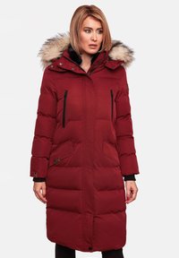 Red insulated parka with a faux fur-lined hood, zippered chest pockets, side pockets, and quilted texture. Long sleeves with ribbed cuffs.