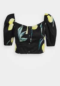 Blusa nera cropped con maniche a sbuffo, chiusura con bottoni frontale e design a stampa di foglie gialle e verdi.