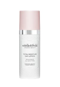 Bouteille cylindrique blanche avec une surface texturée, un capuchon rose mat et un accent argenté. L'étiquette affiche en évidence "Crème hydratante de jour totale".