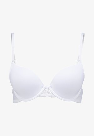 Valge rinnahoidja vormitud tassi ja pitsi aktsendiga keskosas. Reguleeritavad õlapaelad ja tagumine lukustus. Sile tekstuur.