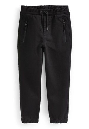 Schwarze Jogginghose mit elastischem Bund, Kordelzug, reißverschlusstaschen vorne und elastischen Bündchen an den Knöcheln.