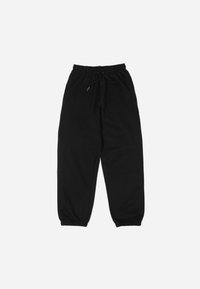 Black sweatpants made of soft fabric with an elastic waistband, adjustable drawstring, and tapered cuffs at the ankles.