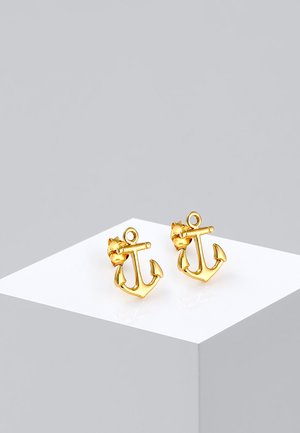 Gold anchor-shaped earrings with a cat's head accent, featuring a shiny texture and small loop for earring posts.
