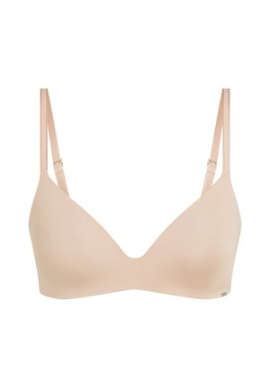 Beiger nahtloser drahtloser BH mit verstellbaren dünnen Trägern und glatten Cups, entworfen für Komfort und den täglichen Gebrauch.