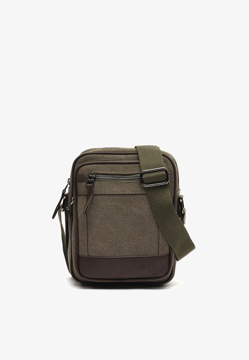 Compact rectangular brown canvas crossbody bag with front zippered pocket and adjustable green strap.