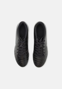 Black athletic shoes with a smooth leather exterior, textured design, and traditional lacing system. Features a cushioned interior.