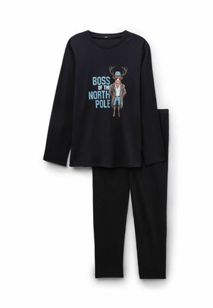 Ensemble de pyjama noir à manches longues avec un graphique représentant un renne en manteau, accompagné du texte "BOSS DU PÔLE NORD", assorti à un pantalon noir.