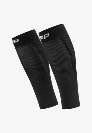 Black compression arm sleeves with textured vertical ribbing, solid top edge, and a white logo detail. Made from a stretchy, breathable material.