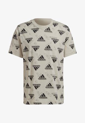 T-shirt beige clair avec des logos Adidas imprimés en noir et des formes géométriques. Fabriqué en tissu doux, il présente un col rond classique et des manches courtes.