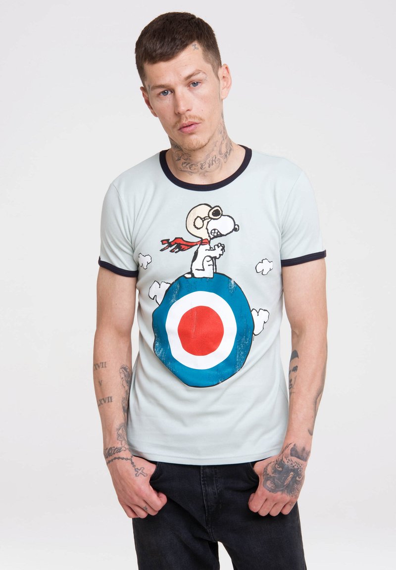 Light blue short-sleeve t-shirt with dark blue collar featuring Snoopy graphic on a target circle, includes red and white accents.
