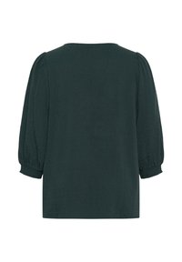 Blouse vert foncé avec des manches bouffantes 3/4 et des poignets élastiques, en tissu texturé, présentée de dos sur fond blanc.