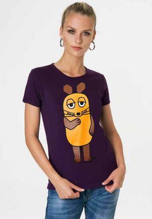Purple short-sleeve t-shirt featuring a cartoon character with a round orange body, brown ears, and whiskers.