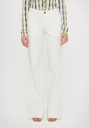 White wide-leg pants with a smooth texture, pockets on the front, and a braided waistband accent. Paired with a multicolored striped shirt.